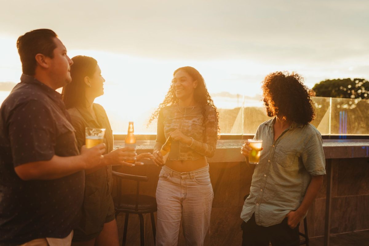 friends on rooftop drinking